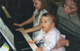 mother and child at the keyboard